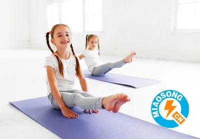 children girls doing yoga and gymnastics in gym